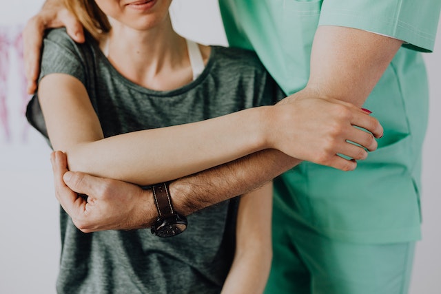 nursing holding a patient